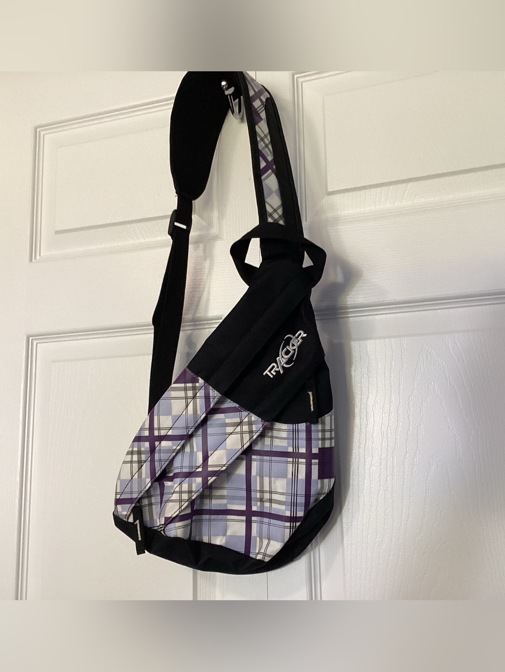 Tracker plaid sling backpack.